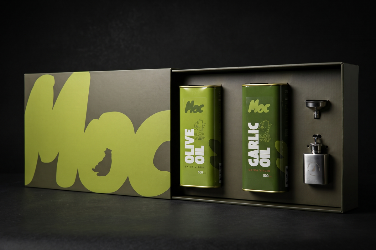 Open Moc gift box holding 500ml tins of Extra Virgin Olive Oil and Garlic Oil with a funnel and refillable key-ring flask